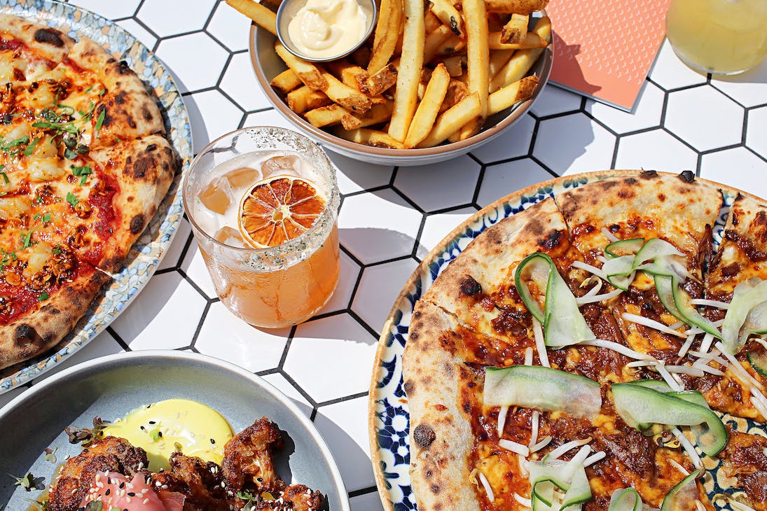 a table full of share food at one of the best restaurants for large groups in Perth